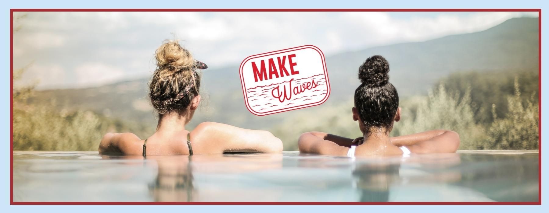 two women looking at forest view over the infinity edge of a pool