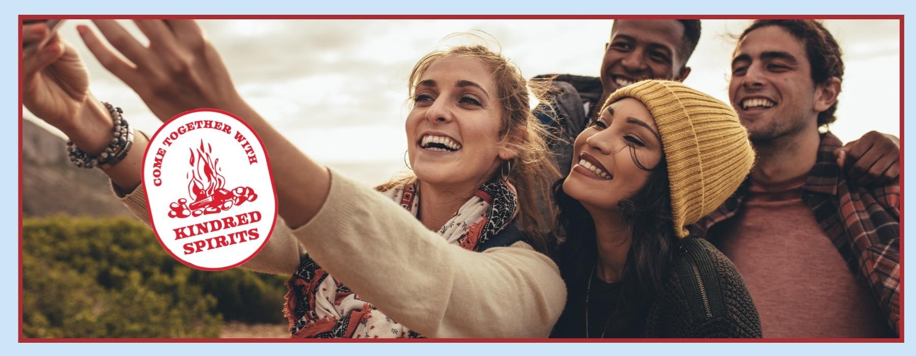 friends taking a group selfie outdoors